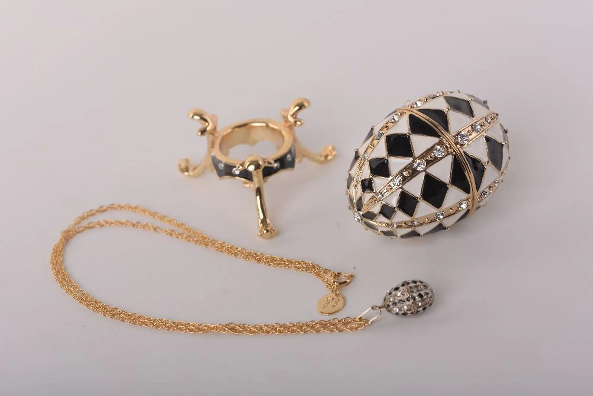 Black and White Faberge Egg with Gold Necklace Inside