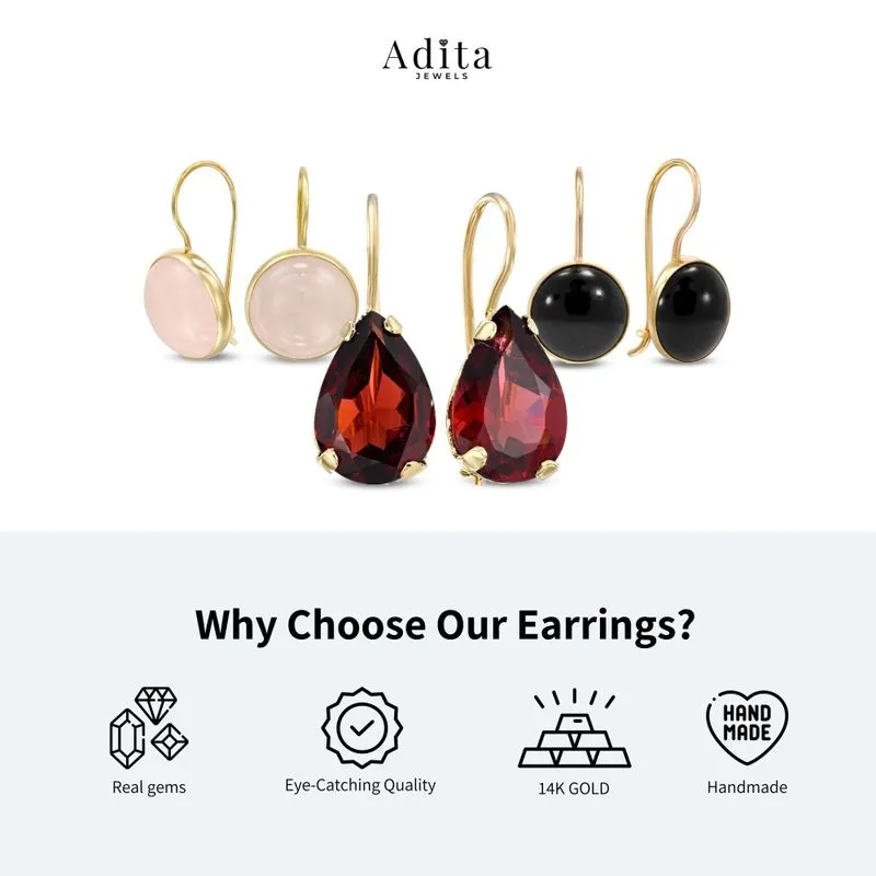 dangling Lucia earrings yellow gold inlaid with garnet stones