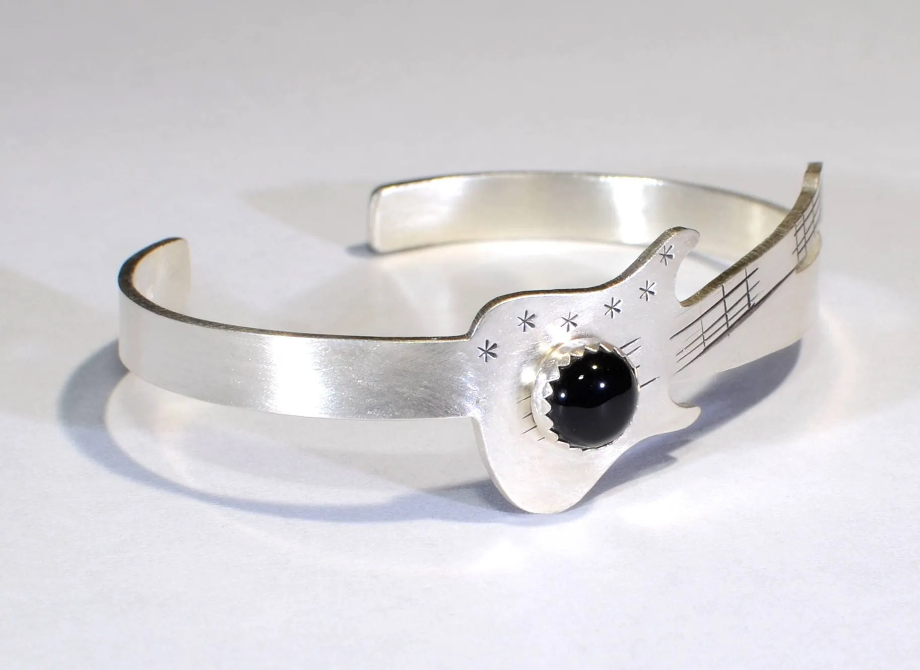 Sterling silver guitar bracelet with black onyx gemstone