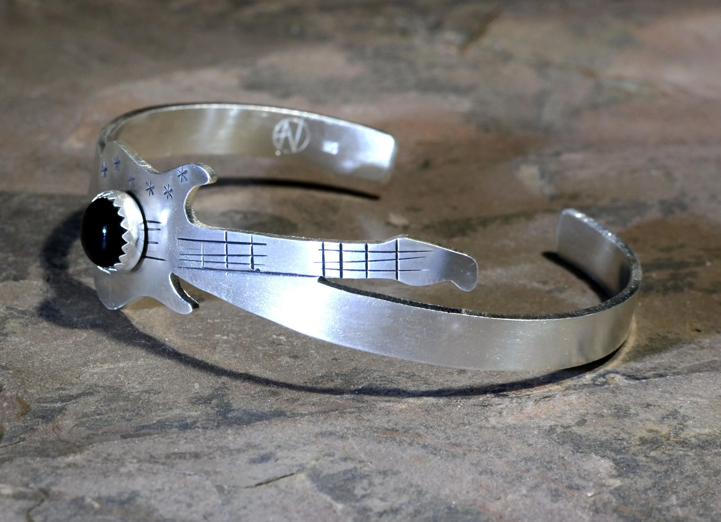 Sterling silver guitar bracelet with black onyx gemstone