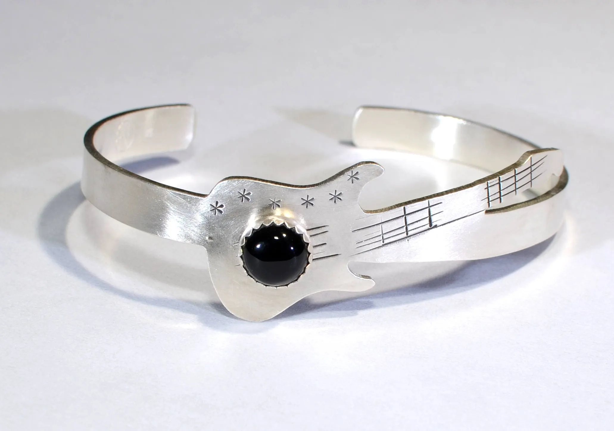 Sterling silver guitar bracelet with black onyx gemstone